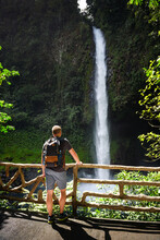 Tourist Looking At The La Fortuna Waterfall In Costa Rica