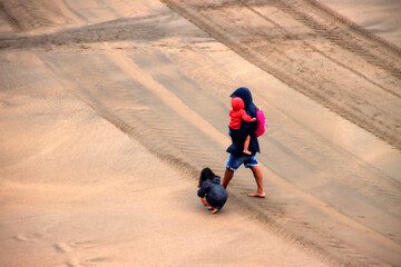 Sticker - Father and son walking on the beach