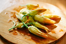 Zucchini Flowers On A Old Wooden Table