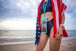 Woman wearing waterproof case for phone and a towel with usa flag