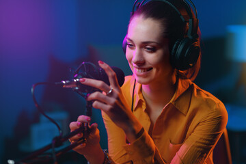 Wall Mural - Young radio presenter working at the radio broadcasting station