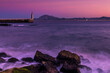 © RooM The Agency - Waves Crashing on Playa Chica beach with statue of Sacred Heart of Jesus and Punta del Santo in distance, Tarifa, cadiz, Andalusia, Spain