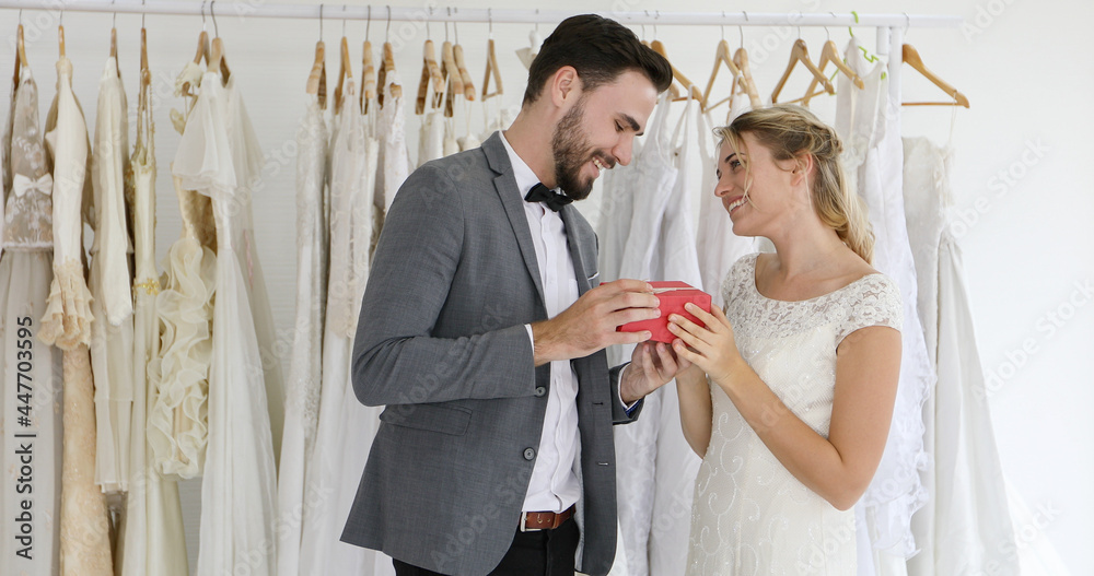 Romantic love of man and woman Couples give gift boxes to the bride.Happy bride and groom in wedding dress prepare for married in wedding ceremony.