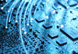 © Image Source RF - Close-up of fibre optics and computer circuit board