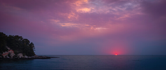 Wall Mural - Moody pink and purple sunset seascape over Old Silver Beach in Falmouth on Cape Cod