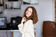 © andrey_orlov - Happy friendly woman posing indoor at home in casual clothes, teenage student or young girl with beautiful face and wide smile looking at camera, cute pretty millennial lady headshot portrait