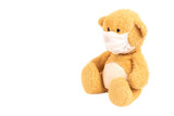 Fototapeta  - Toy Teddy Bear In Medical Mask Isolated On White Background.