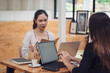 © amnaj - Young Asian businesswoman meeting working together at the office.