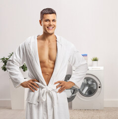 Poster - Handsome young man wearing a white bathrobe