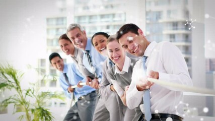 Poster - Molecular structures floating against diverse businesspeople pulling a rope together at office