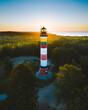 © AmazingAerialAgency - Aerial view of Nida lighthouse in early summer morning light. Shot in Lithuania.
