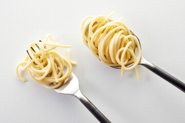 Sticker - Top view of a fork and spoon with small heaps of spaghetti