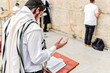© Marcela Ruty Romero - Young Orthodox Jewish man praying with phylacteries (tefilin), at the Western Wall.