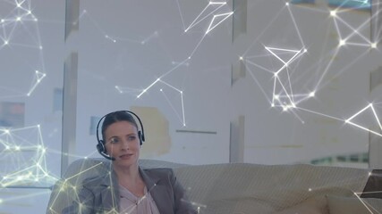 Sticker - Animation of network of connections over businesswoman with headset in office