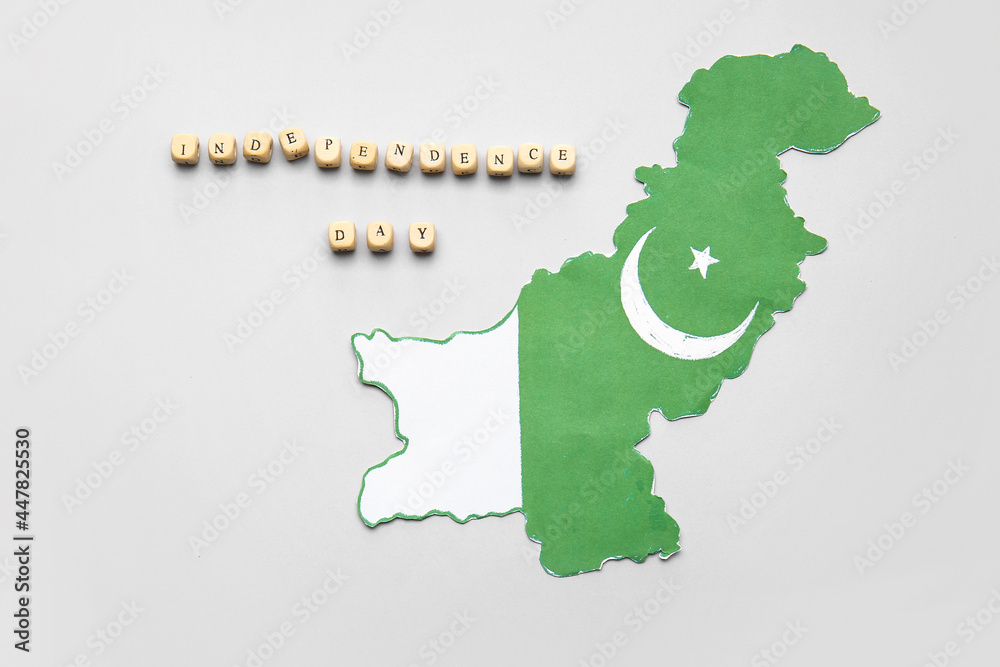 Flag map of Pakistan and text INDEPENDENCE DAY on light background