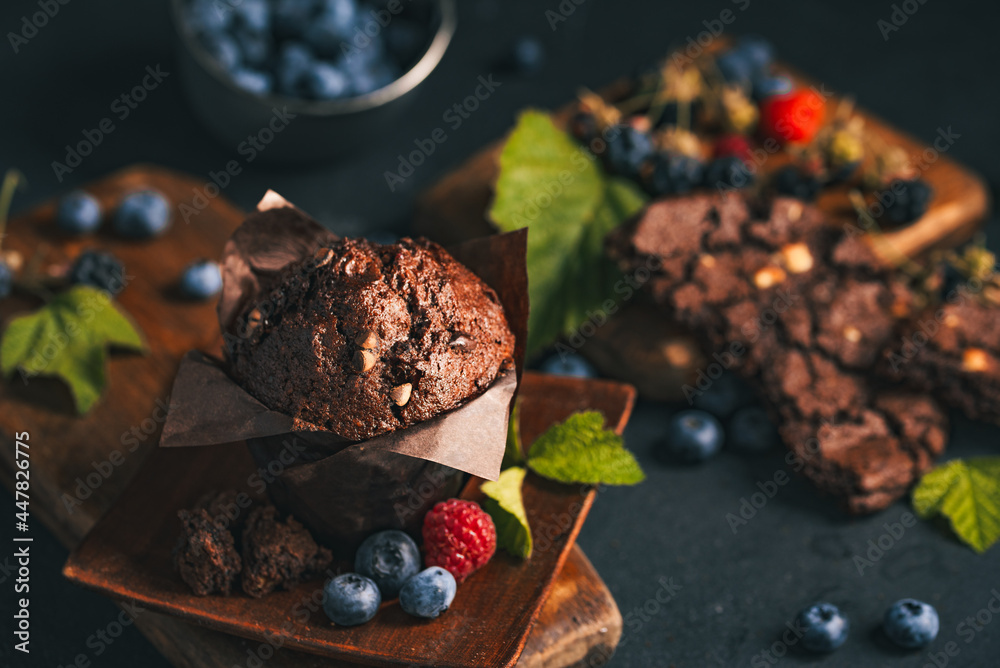 Chocolate muffin. Muffin with chocolate and fruits. Fruit muffin. - obrazy, fototapety, plakaty 