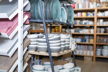 Wall Mural - Various ceramic plates for sale in tableware department of home furnishings store..