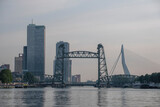 Fototapeta Nowy Jork - City of Rotterdam downtown skyline at dusk in South Holland, Netherlands, Erasmus Bridge