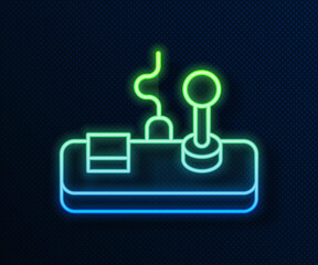 Sticker - Glowing neon line Gamepad icon isolated on blue background. Game controller. Vector