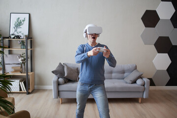Wall Mural - man with virtual reality headset is playing game.