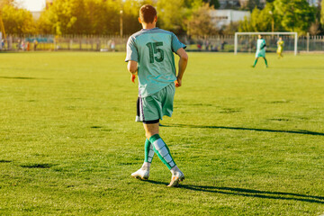 Professional soccer player, soccer player in action at the stadium, hitting the ball to reach the goal, Sport concept, competition