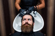 © be free - brutal hipster with moustache wash hair before new hairstyle. barbershop washbasin. male trendy hairdo. perfect haircut. barber master cut hair. mature hipster with beard at hairdresser. mens health