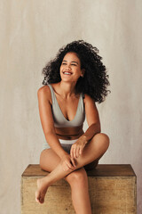 Wall Mural - Black female model feeling happy in her natural body