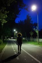 Woman In The Park At Night