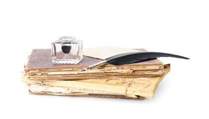Feather pen, inkwell and old books on white background