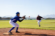 © Wavebreak Media - Mixed race female baseball player on sunny baseball field reaching to catch ball during game