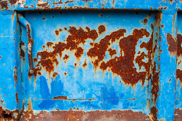 rust on blue metal surface