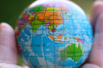 Poster - Globe on wood table background and space for text, eco day, save earth day