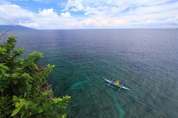 Wall Mural - Traditional outrigger on the water in the Philippines