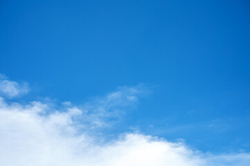 Blue sky with white clouds and copy space in daylight for background.