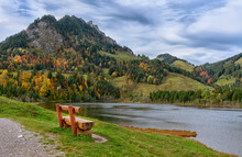 Autumn, Bench On The Shore Schwarzsee Lakes In The Eastern Foothills Of The Alps (Foralpen) - The Dark Waters Of The Schwarzsee Lake And The Alpine Brekka Abis Valley, Formed By Glaciers.