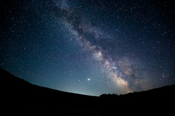Gorgeous night landscape with bright Milky Way.