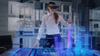 © Iokanan Pro - Professional Female Architect wearing Augmented Reality Glasses makes gestures and redesigns 3D City Model. High Tech Office use Virtual Reality Holographic Modeling Software Application.
