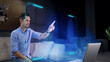 © Iokanan Pro - Mockup: A man works on a futuristic holographic display from home using his fingers as he touches an augmented reality virtual display. Concept: Future and Technology