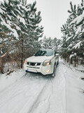 Fototapeta Uliczki - suv car in snowed forest