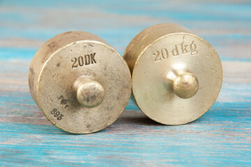 Wall Mural - Two antique bronze weights for scales.