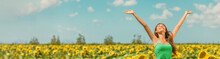 Spring Happy Woman With Open Arms Walking In Sunflower Field Enjoying Free Nature Landscape Banner Panoramic. Asian Girl Relaxing Breathing Clean Air Outside.