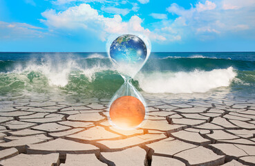 Poster - Global warming concept-Planet Earth is becoming a dead planet like Mars - Hourglass inside Planet Earth and Mars isolated -Cracked mud tiles in power sea wave