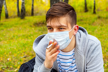 Wall Mural - Young Man smoke a Cigarette