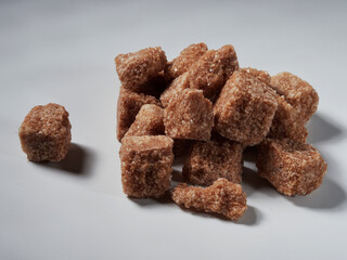 brown sugar cubes isolated on a white background