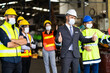 © NVB Stocker - Group of diversity engineers Workers team wear protective face masks for safety in meeting. Success Worker man wearing face mask prevent covid-19 virus and protective hard hat.