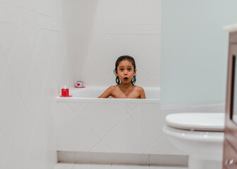 Canvas Print - Little kid girl taking a shower