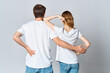 © SHOTPRIME STUDIO - man and woman in white t-shirts stand with their backs design studio