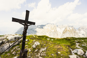 Wall Mural - Mountain summit cross on the top of the alps