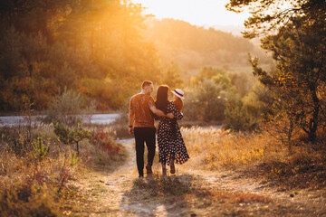 Family with their little daughter in an autumn field