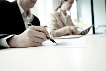 Wall Mural - focus Close up shot businessman hand and woman sitting in the office